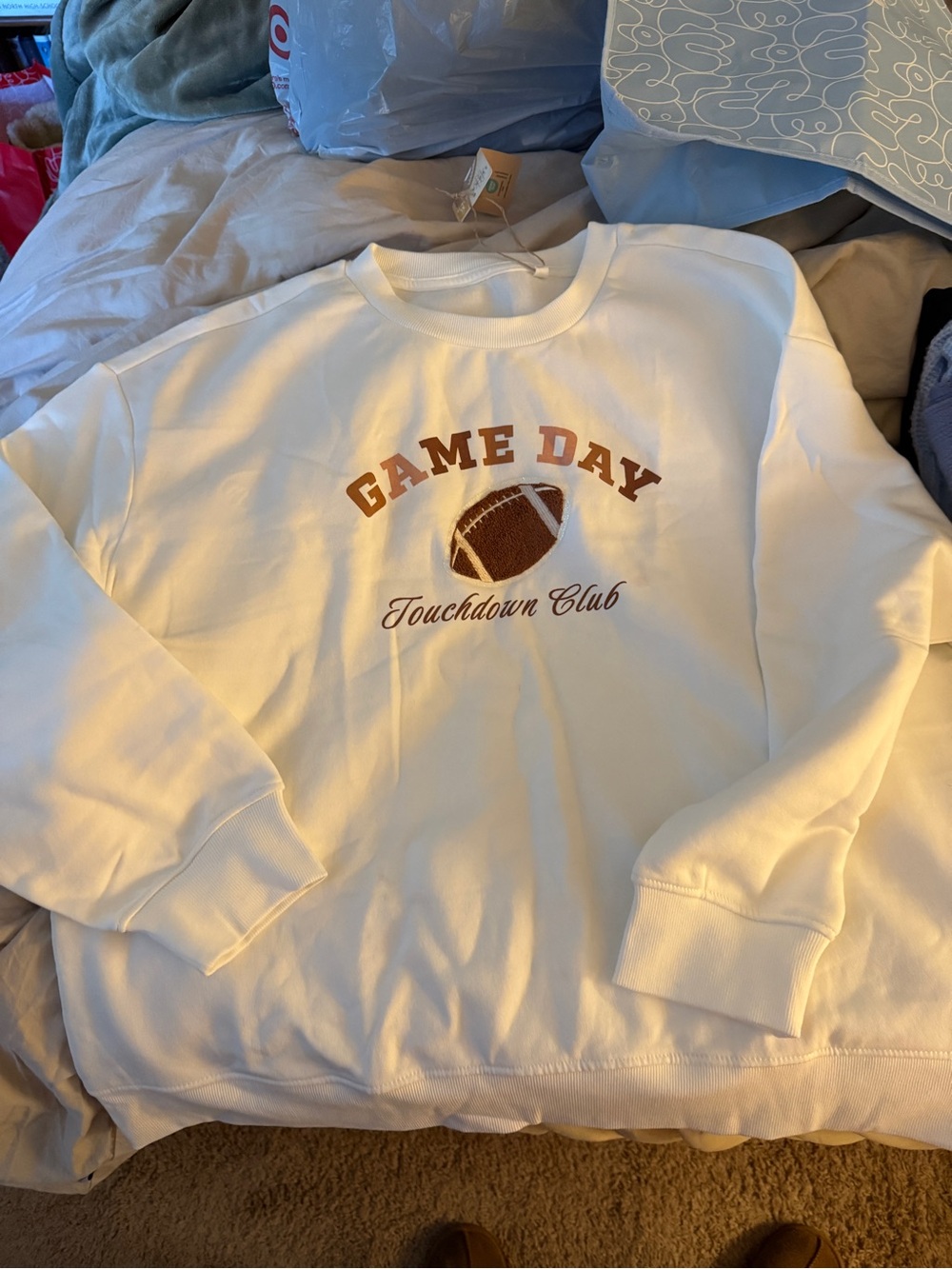 Serra White Sweatshirt with Brown Football Graphic